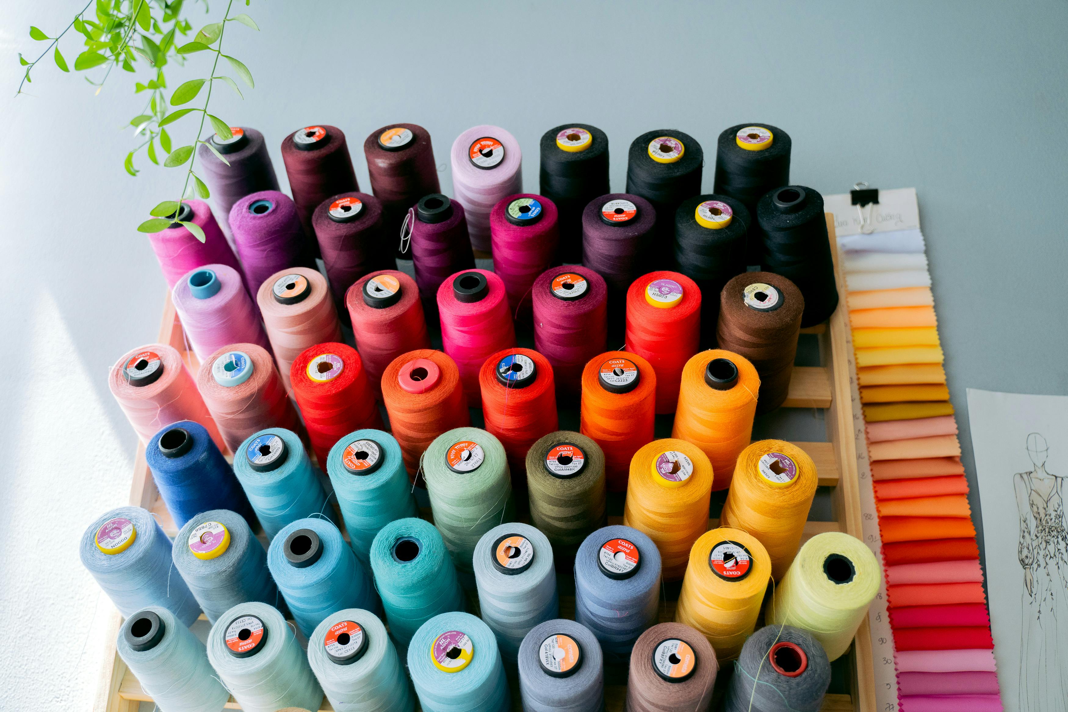 Colorful spools of thread arranged beautifully